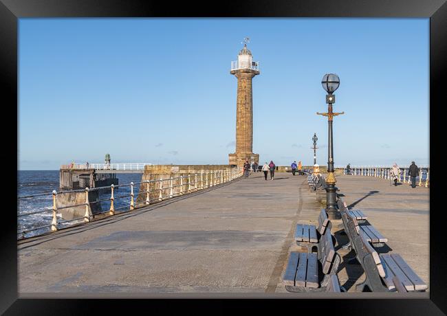 West Pier harbour lighthouse from the west pier, Whitby, Yorkshire, England Framed Print by Dave Collins