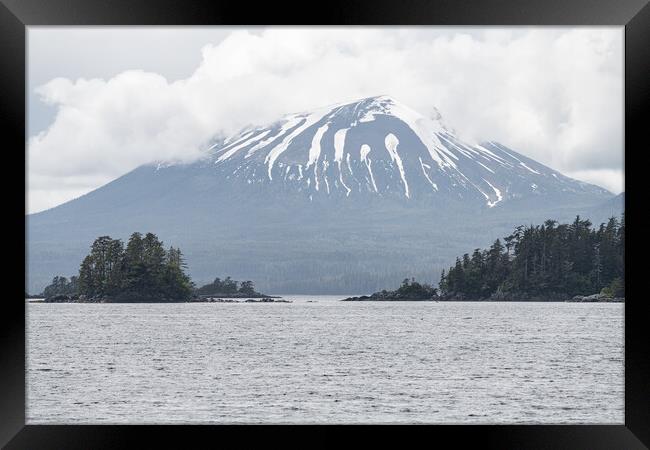Islands and Snow Topped Mountains at Sitka, Alaska, USA. Framed Print by Dave Collins
