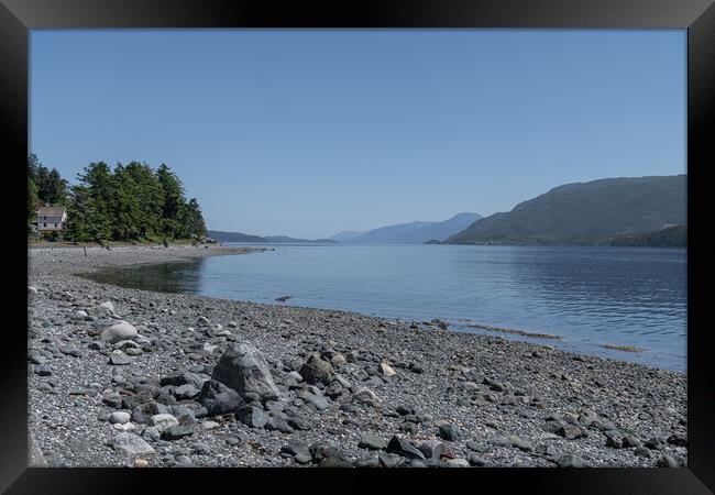 The Beach and a water front house in of Alert Bay, British Columbia, Canada Framed Print by Dave Collins