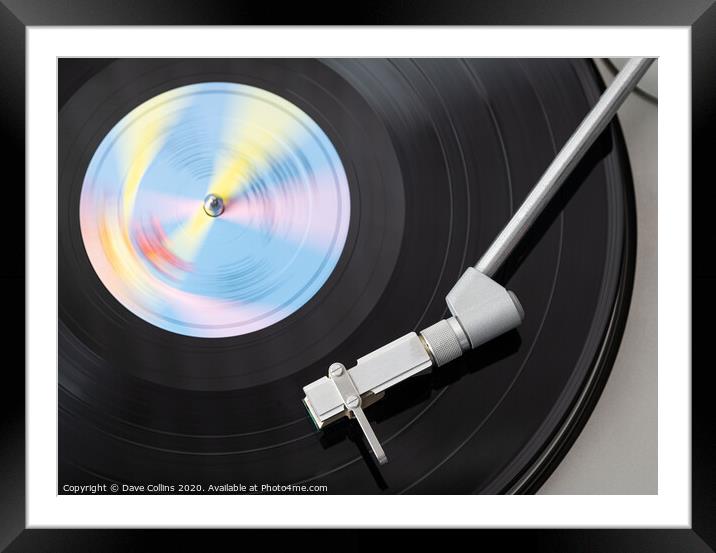 Vinyl Record Playing on a Record Player Framed Mounted Print by Dave Collins