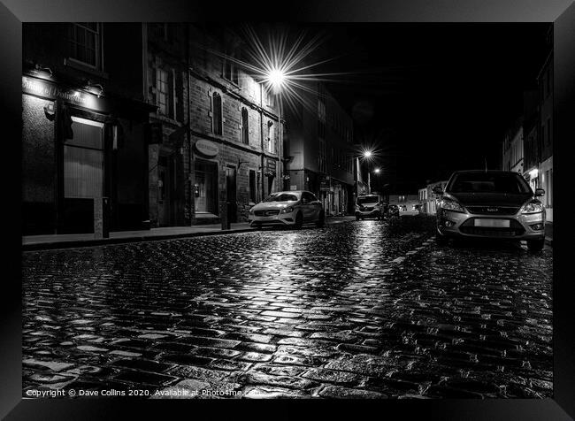 Rain soaked cobbled street at night, Kelso, Scotla Framed Print by Dave Collins