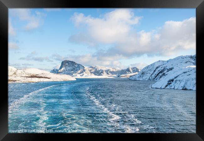 Cruising between the islands in Winter in Norway Framed Print by Dave Collins