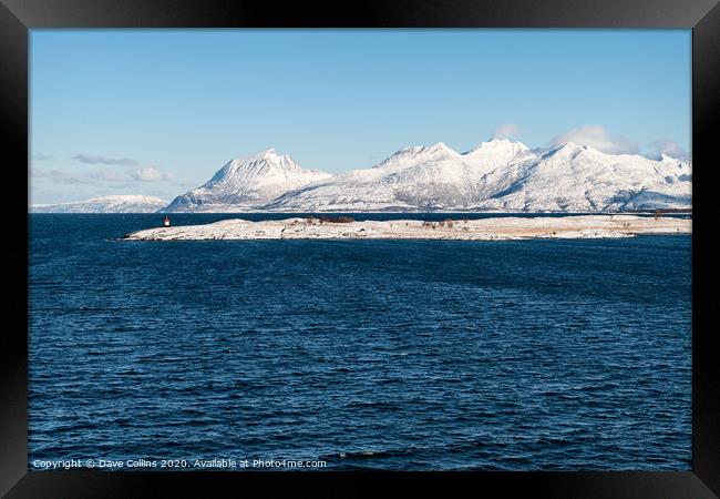 Snow covered hills on the Norwegian Coast in winter Framed Print by Dave Collins