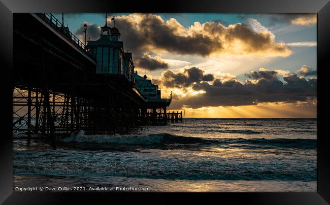 Sunrise and sunrays over Eastbourne Pier Framed Print by Dave Collins