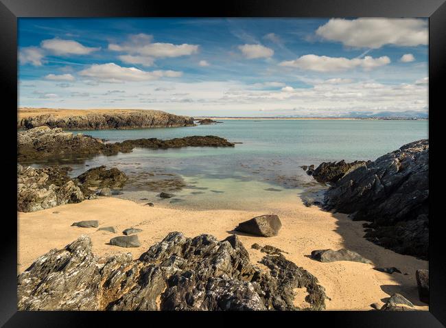 Snow-capped serenity in Rhoscolyn Cove. Framed Print by Colin Allen