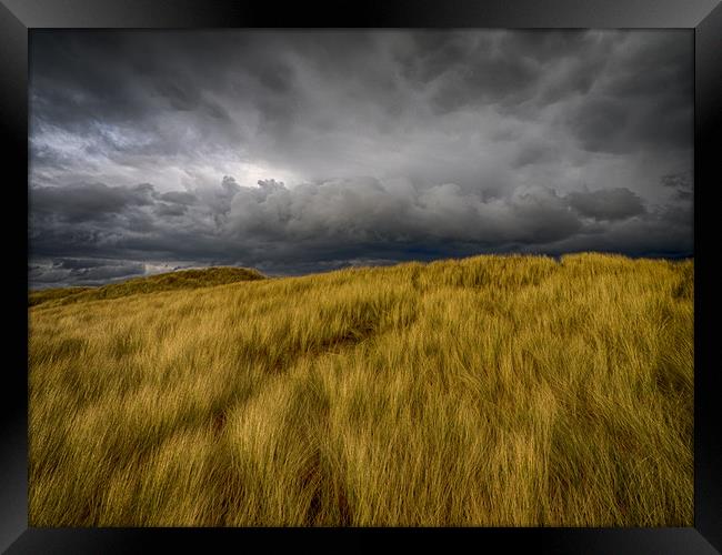 Storm Clouds over the Sand Dunes at Aberffraw Framed Print by Colin Allen