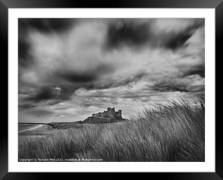 Gathering storm over Bamburgh Castle Framed Mounted Print by Richard Pike
