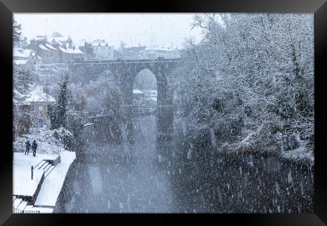Winter snow over the river Nidd and famous landmark railway viaduct in Knaresborough, North Yorkshire Framed Print by mike morley