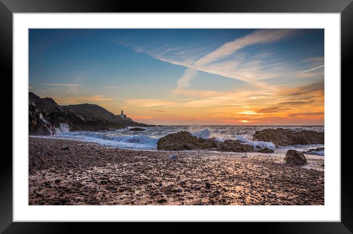 Sunrise at Mumbles lighthouse. Framed Mounted Print by Bryn Morgan