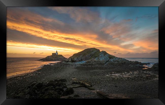 Sunrise at Mumbles lighthouse with the tide going  Framed Print by Bryn Morgan