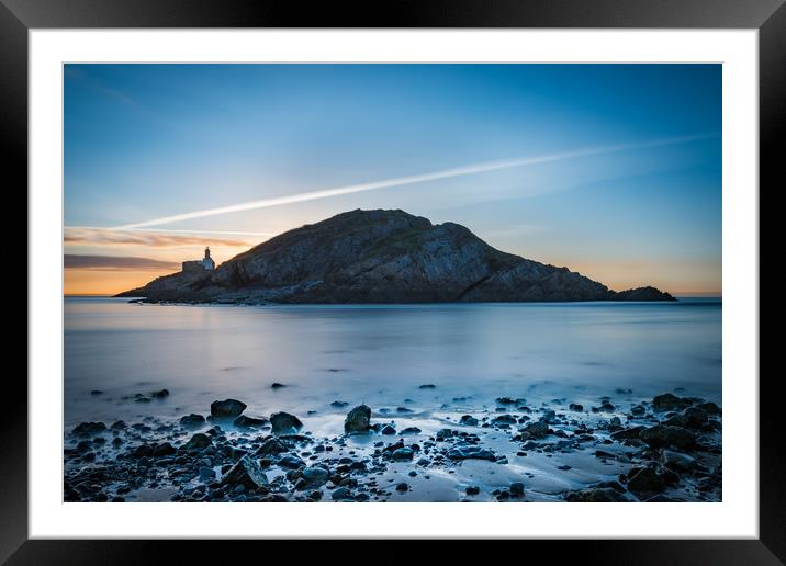 Sunrise at Mumbles lighthouse. Framed Mounted Print by Bryn Morgan