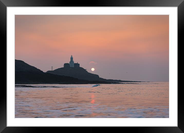 Sunrise at Mumbles lighthouse. Framed Mounted Print by Bryn Morgan