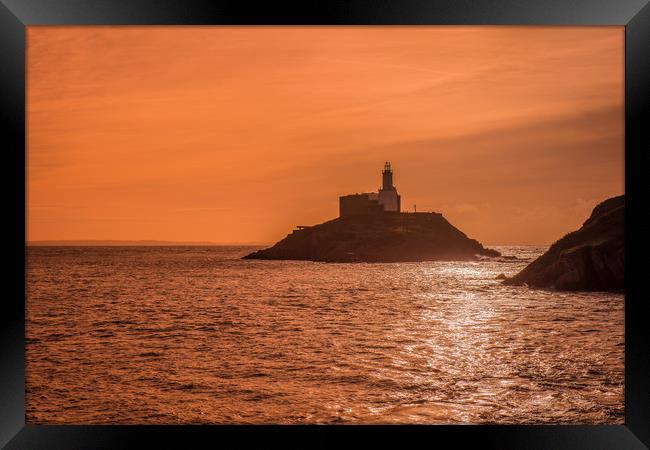 Mumbles lighthouse at sunrise. Framed Print by Bryn Morgan