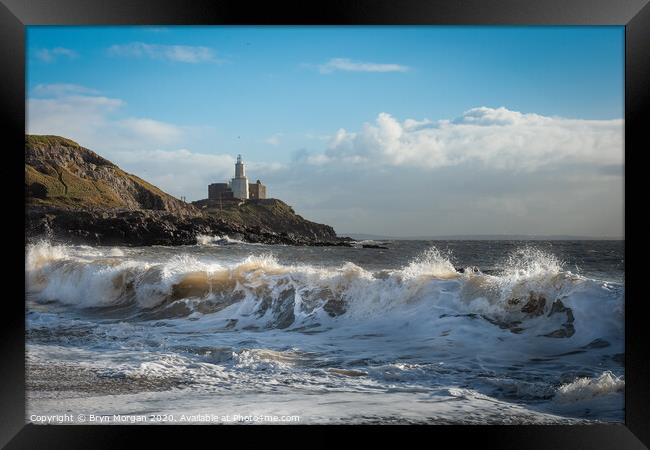 Mumbles lighthouse and wave Framed Print by Bryn Morgan