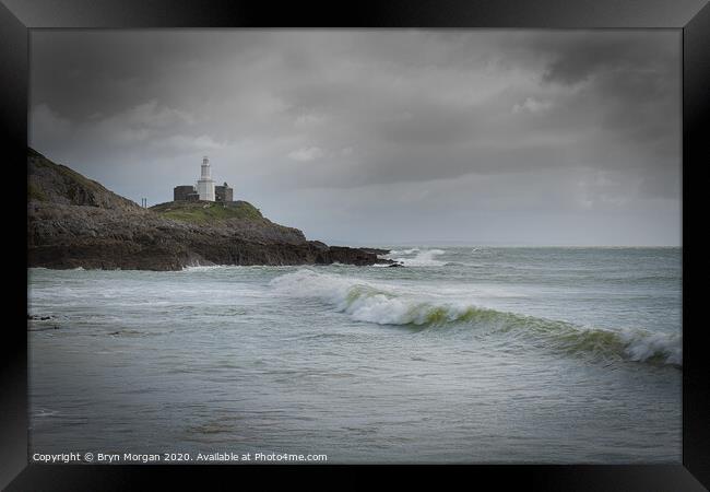 Mumbles lighthouse with wave. Framed Print by Bryn Morgan