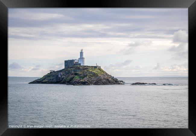 Mumbles lighthouse from the pier Framed Print by Bryn Morgan