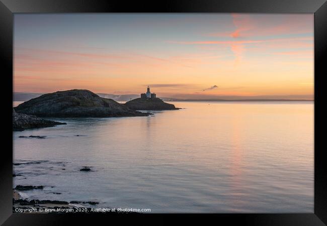 Mumbles lighthouse viewed from Bracelet bay Framed Print by Bryn Morgan