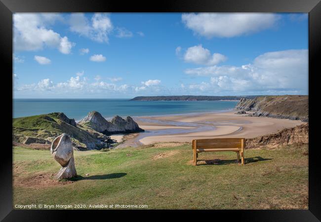 Bench overlooking Three Cliffs Bay Framed Print by Bryn Morgan