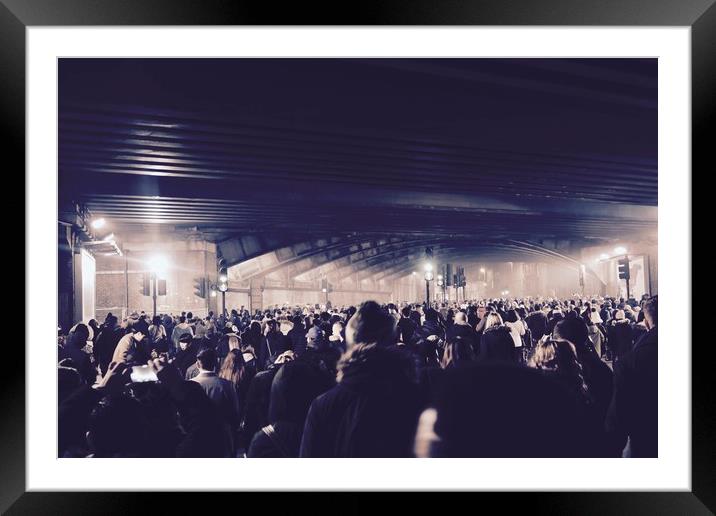 Crowds leaving Westminster Bridge on New Year's Ev Framed Mounted Print by Mike Evans