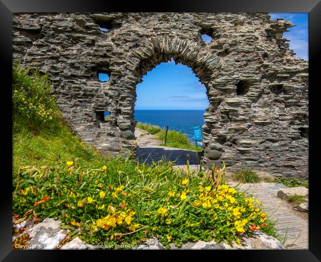 Tintagel Castle in Cornwall, UK Framed Print by Chris Dorney