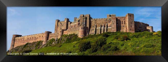 Bamburgh Castle in Northumberland, UK Framed Print by Chris Dorney
