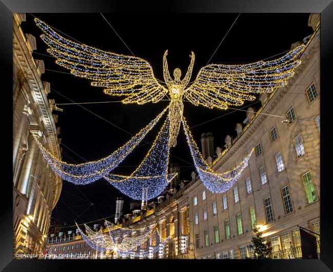 Regent Street Christmas Lights in London, UK Framed Print by Chris Dorney