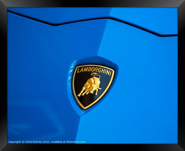 Lamborghini Badge on a Car Framed Print by Chris Dorney