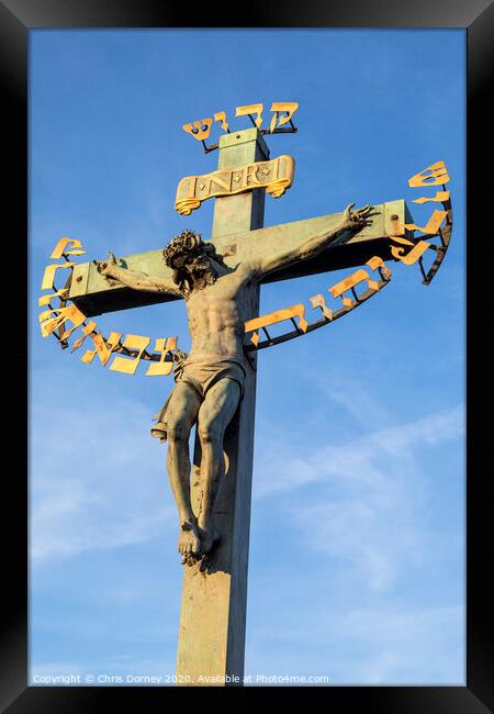 Crucifix Statue on the Charles Bridge in Prague Framed Print by Chris Dorney