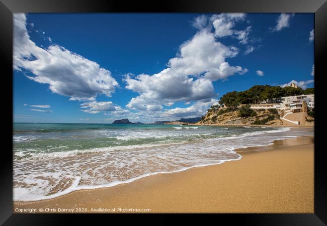 El Portet Beach in Moraira Framed Print by Chris Dorney