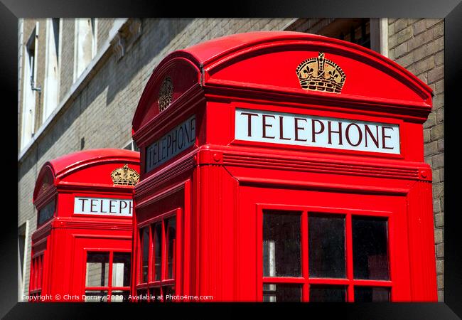 Red Telephone Boxes in London Framed Print by Chris Dorney