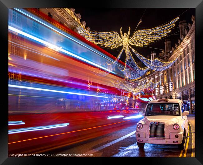 Regent Street Christmas Lights in London Framed Print by Chris Dorney