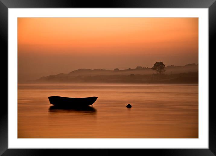 Rowing boat at rest on the river at sunrise Framed Mounted Print by Lindsay Philp