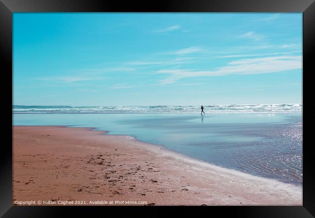 Silhouette of lone jogger on Mawgan Porth beach Framed Print by Milton Cogheil