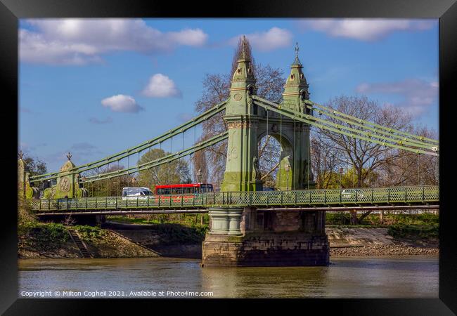 Red London bus on Hammersmith Bridge Framed Print by Milton Cogheil