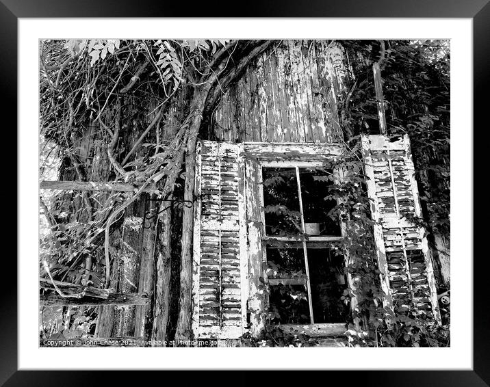 Overgrown Shed and Window Framed Mounted Print by John Chase