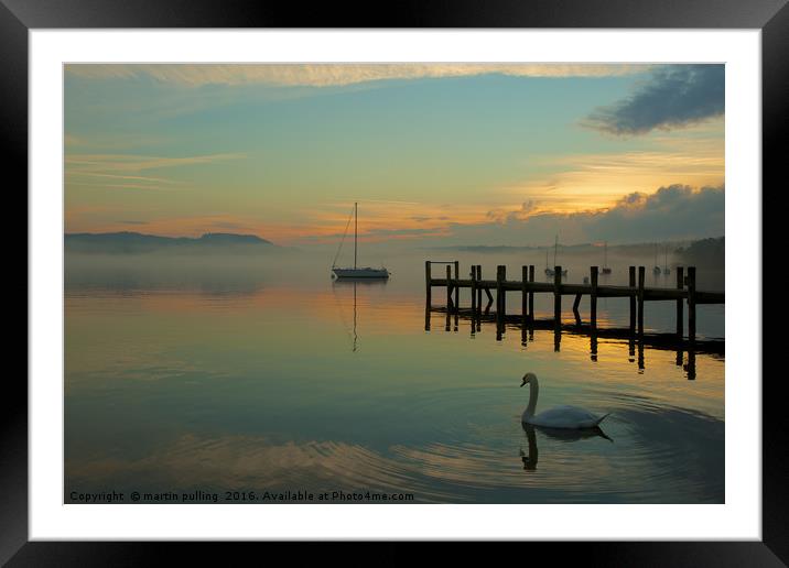 lonely swan on windermere Framed Mounted Print by martin pulling