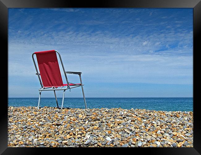 Waiting at Weybourne- Red Chair left on the Beach Framed Print by john hartley