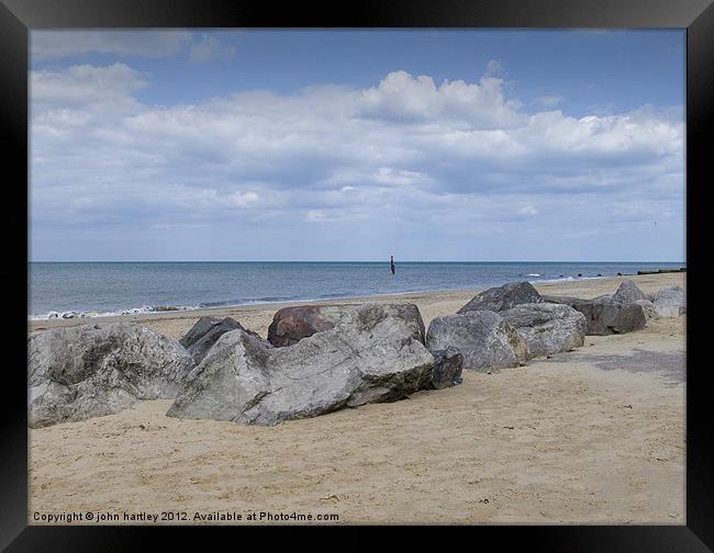 Rocks on the Beach - Cart Gap Beach Norfolk Framed Print by john hartley