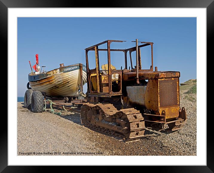 Rusty Caterpillar Beach Tractor with Fishing Boat  Framed Mounted Print by john hartley