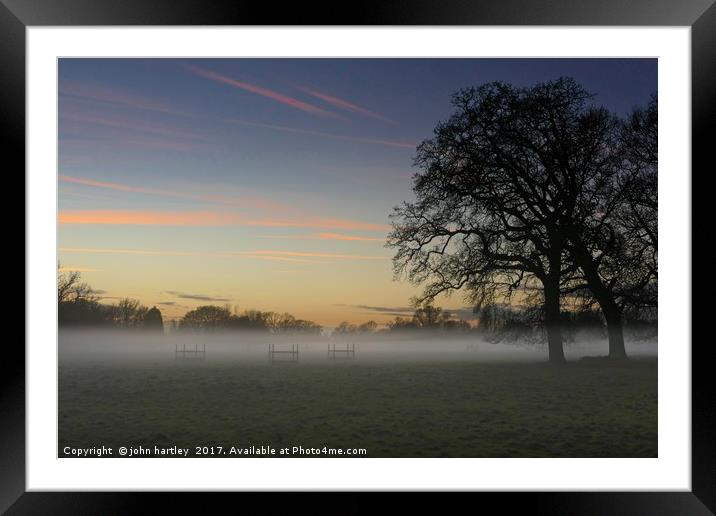Veil of Mist, silhouetted trees, Sunset over a Win Framed Mounted Print by john hartley