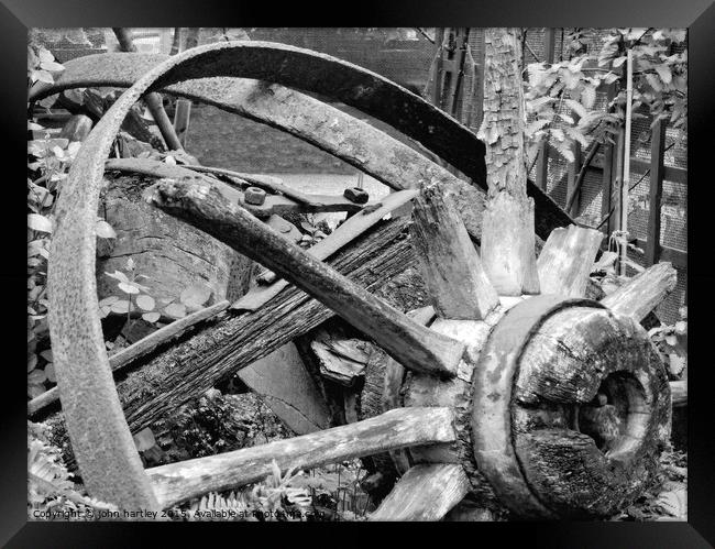The Hub-Broken wooden cart wheel in Mono Framed Print by john hartley
