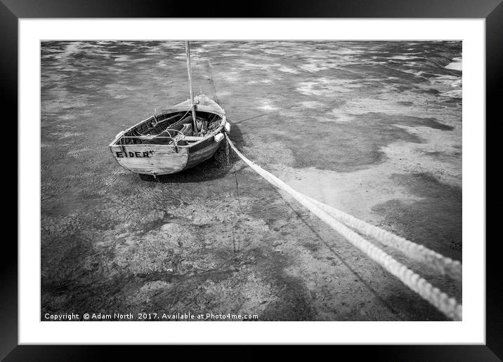 Stranded rowing boat at low tide Framed Mounted Print by Adam North