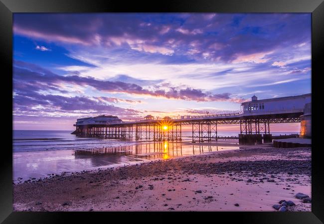 Cromer pier with sunrise starburst Framed Print by Mark Hawkes