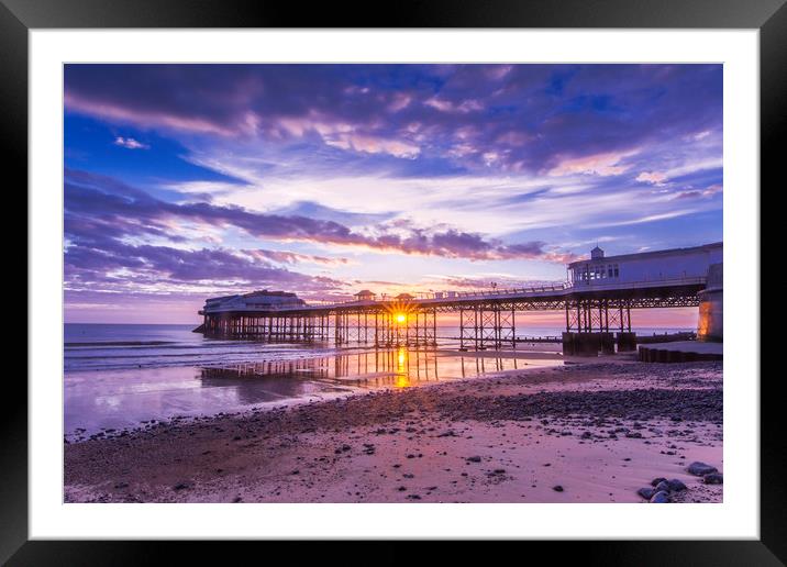 Cromer pier with sunrise starburst Framed Mounted Print by Mark Hawkes