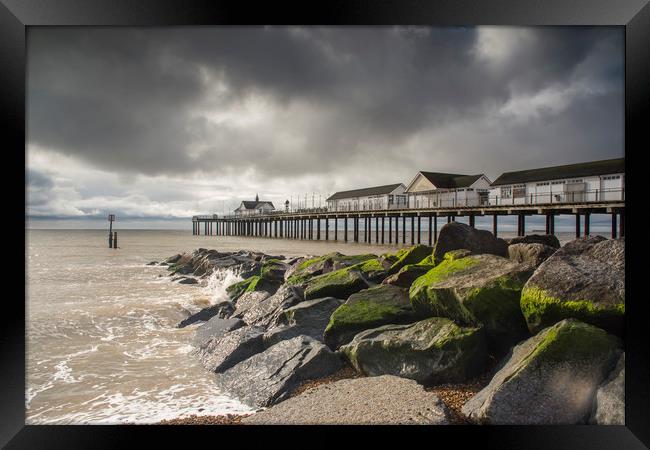 Southwold Pier storm clouds Framed Print by Mark Hawkes