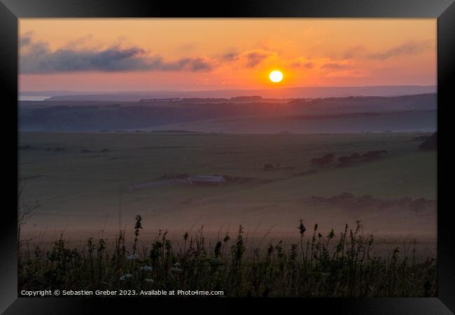 Sunset over the South Downs from Beachy head Framed Print by Sebastien Greber
