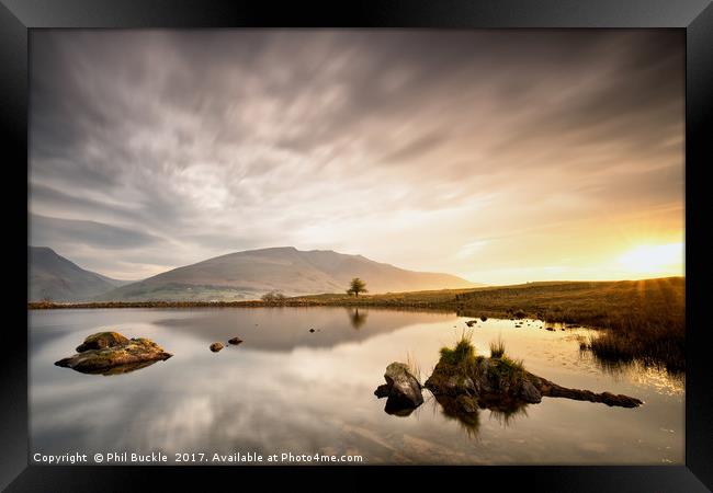 Sunrise Reflections at Tewet Tarn Framed Print by Phil Buckle