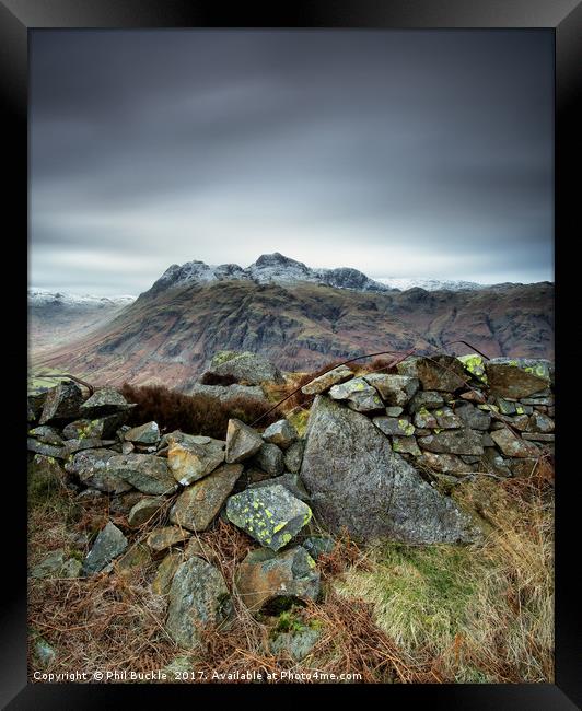 Langdales Beyond the Wall Framed Print by Phil Buckle