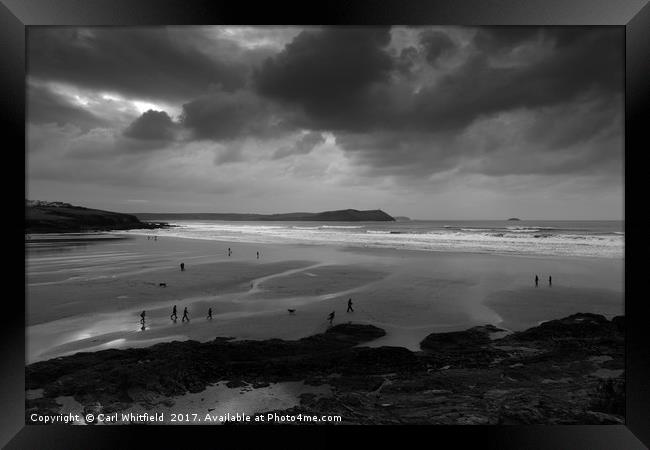 Stormy Polzeath in Cornwall, England. Framed Print by Carl Whitfield