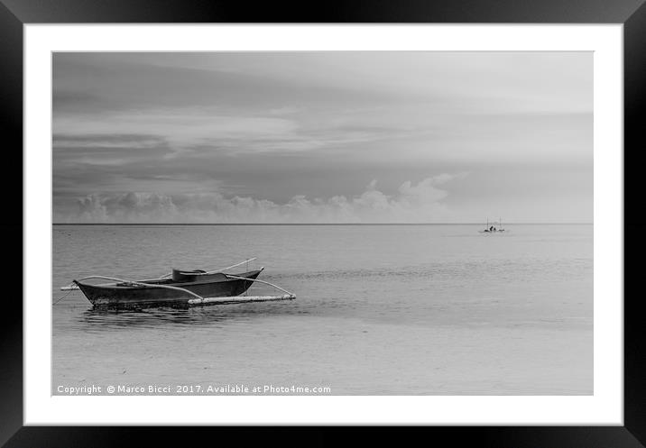 A filipino boat with a fisherman at the horizon Framed Mounted Print by Marco Bicci